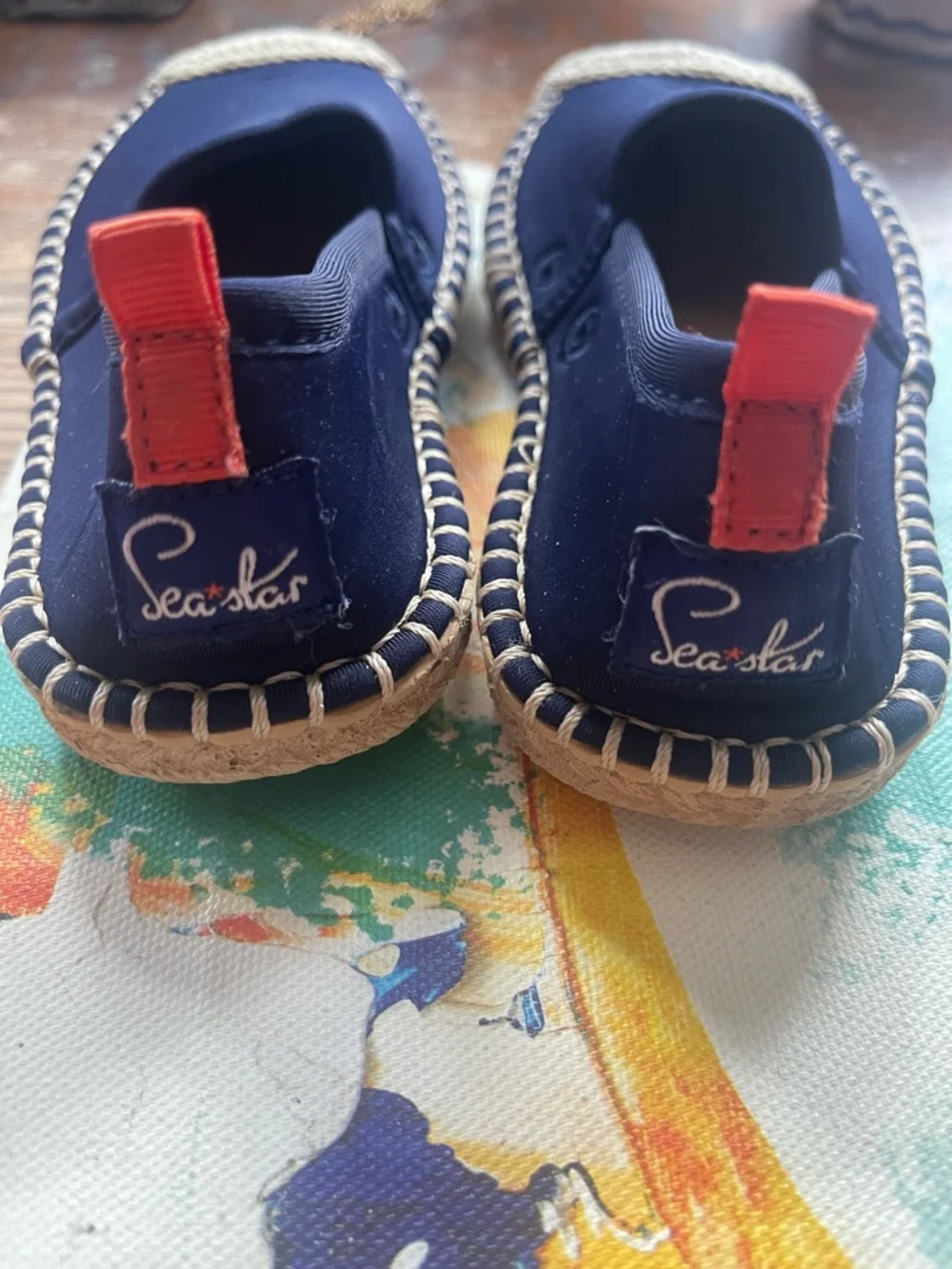 Size 9 Kids unisex Sea Star Espadrilles. Navy Slip-ons with Red Pull on tab.